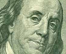 face of Ben Franklin on the dollar bill up close