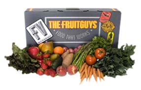 FruitGuys box with fruits and vegetables laying around it