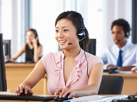 woman answering call on headset