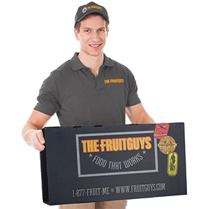 A man holding a medium FruitGuys Box