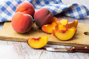 Whole and sliced peaches