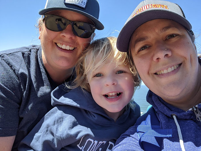 two moms and little boy