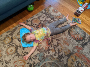 Little boy in floor stretch