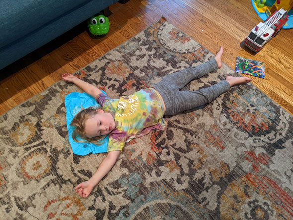 Little boy in floor yoga stretch