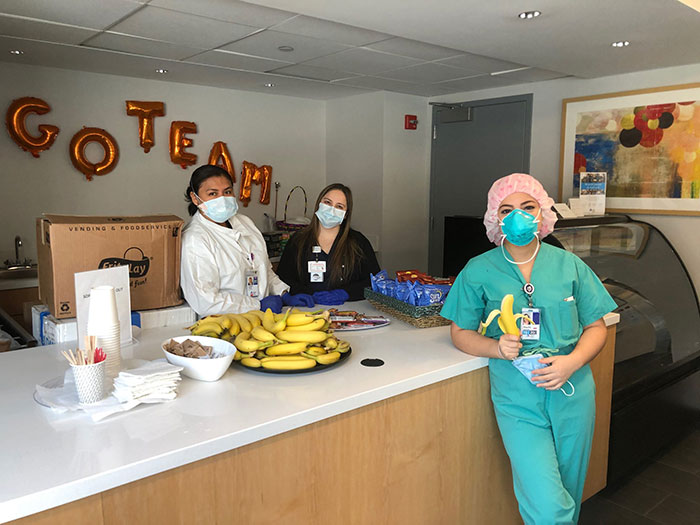 Health Care workers at Mount Sinai Queens Hospital in Queens, NY take a break to enjoy a piece of fresh fruit.