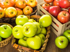 variety of apples in baskets