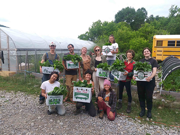 Farmers showing harvested produce