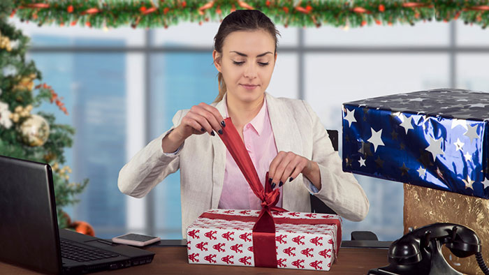 employee opening holiday gift