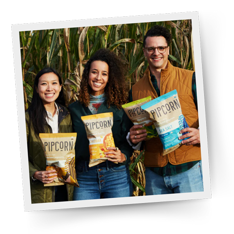 The founders of Pipcorn, one of The FruitGuys Pride Snacks