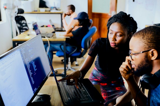 Black employees working at a computer