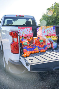 Fruit World produce loaded in a pickup