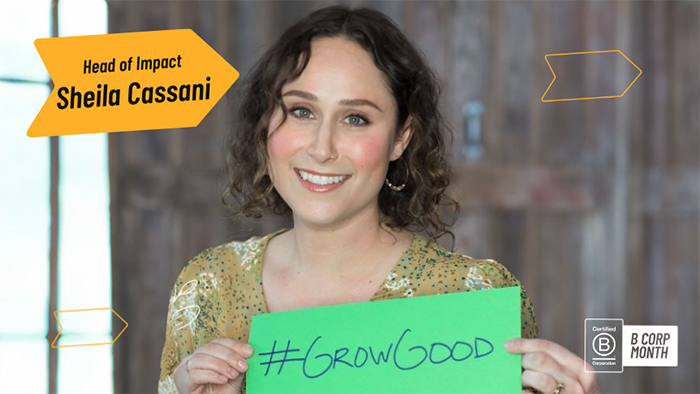 Head of Impact Sheila Cassani holding a "#GrowGood" sign