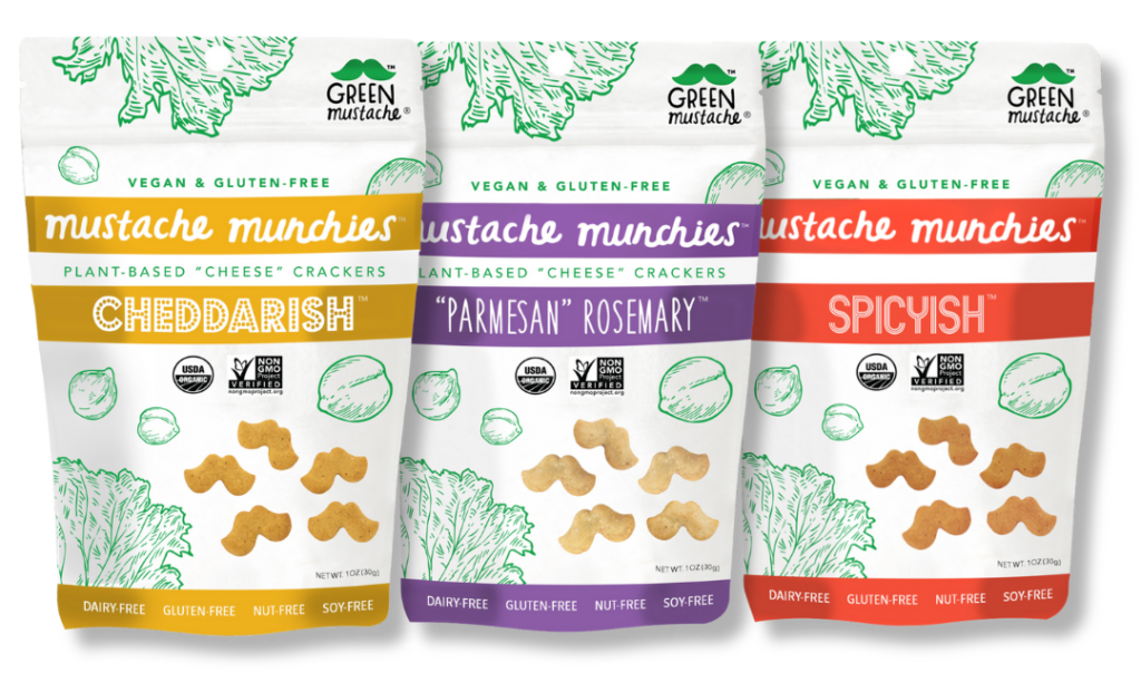 AAPI-owned snacks: Mustache Munchies in three flavors: Cheddarish, "Parmesan" Rosemary, and "Spicyish." Packaging reads "vegan & gluten-free, plant-based "cheese" crackers, dairy-free, gluten-free, nut-free, soy-free"
