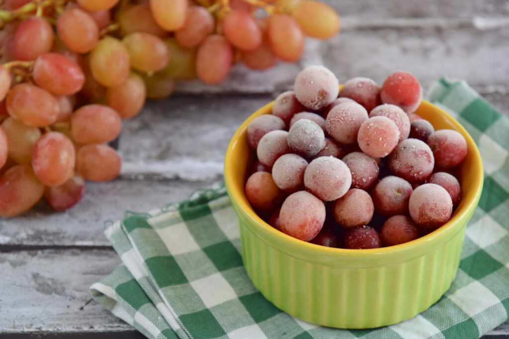 Frozen grapes on ramekin; healthy snack