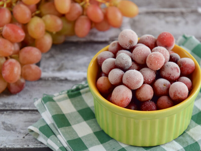 Frozen grapes on ramekin; healthy snack