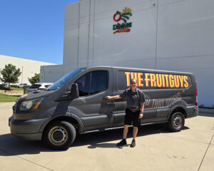 Fresh fruit delivery driver and The FruitGuys: Food That Works van