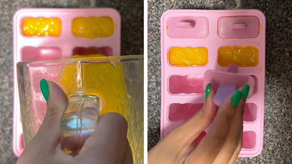 Mango-orange popsicles in progress, mixture poured into popsicle mold and sticks added