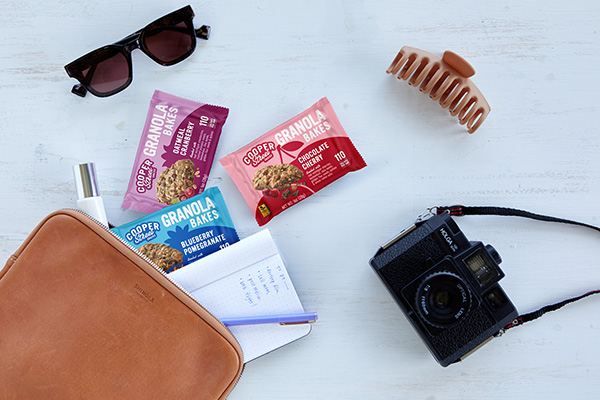 Cooper Street Granola Bakes spilling out of a purse with other items