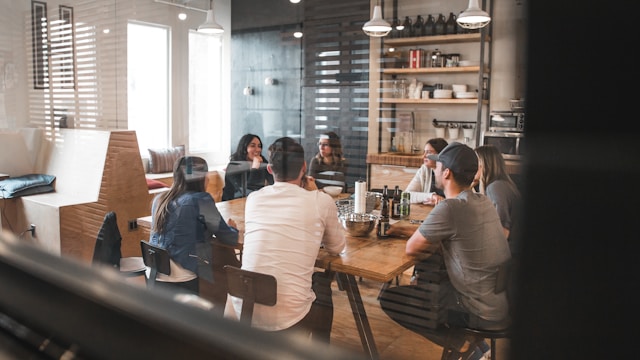 Workers gathered in an office break room