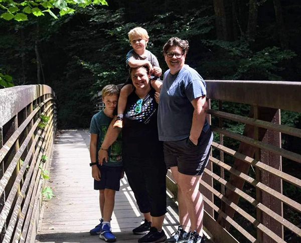 Couple and two kids on a bridge