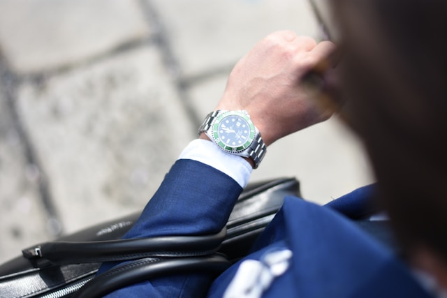 Businessman with watch and briefcase