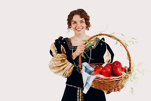 Princess holding a basket of apples