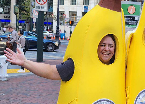 Smiling woman in banana suit