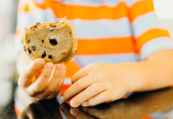 Boy holding cookie