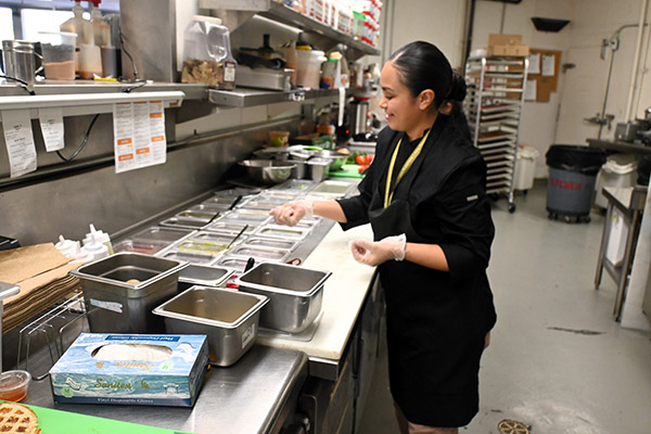 Woman working in commercial kitchen