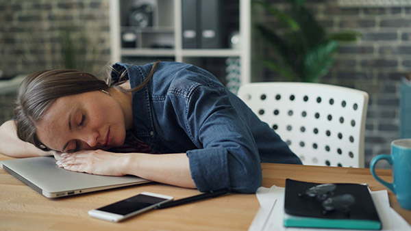 Woman asleep at desk