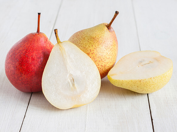 Pears whole and halved, red and yellow