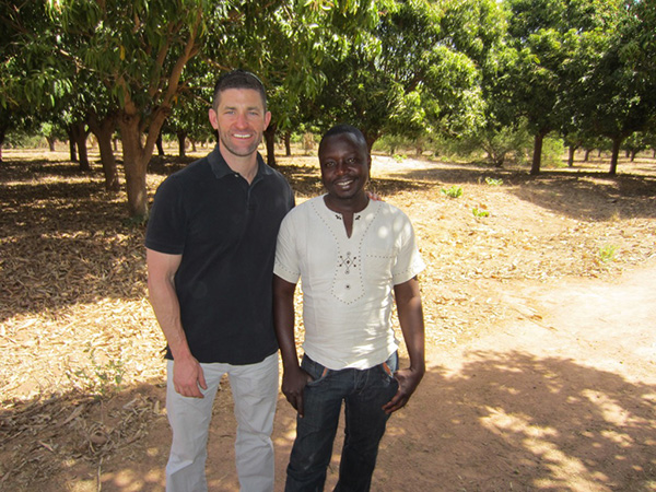 Two men smiling outdoors