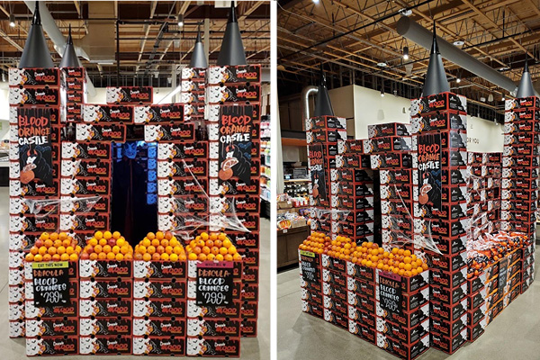 Boxes of blood oranges stacked in the shape of a castle with Blood Orange Castle sign 