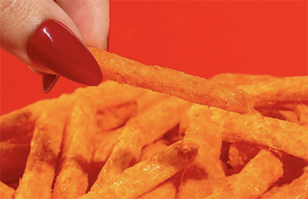 Woman's fingers grabbing fry