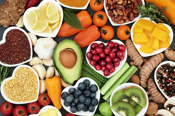 Spread of healthy foods, some in heart-shaped dishes