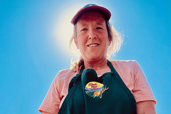 Smiling woman against blue sky