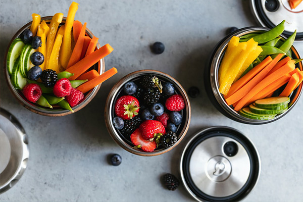 Containers of fresh berries and vegetables