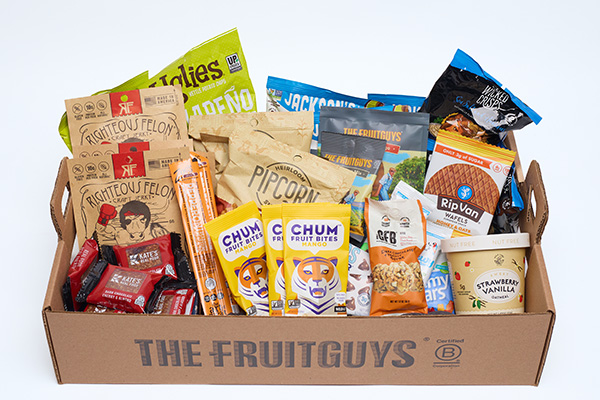 Packaged snacks in a The FruitGuys snack tray