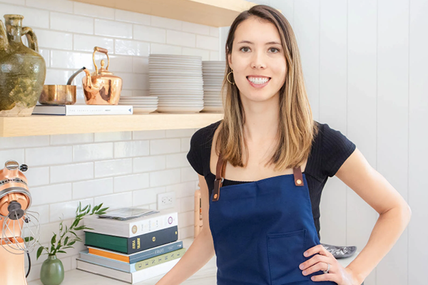 Smiling woman in a kitchen