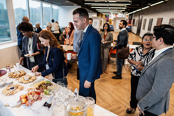 Clients and guests serving themselves from an office refreshments table