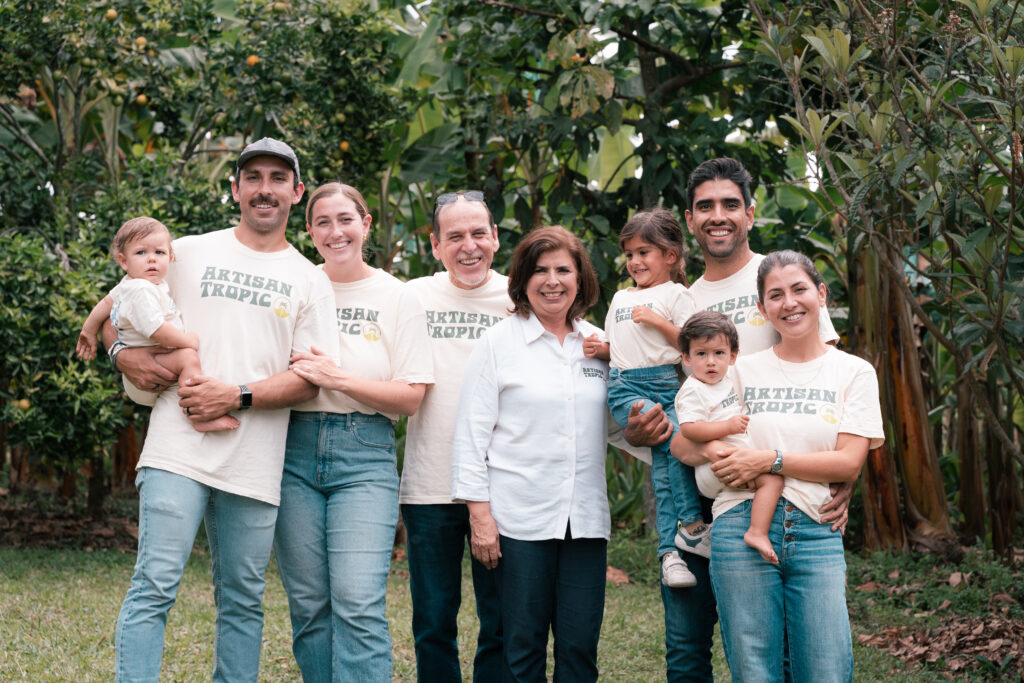 Smiling family in front of a forest