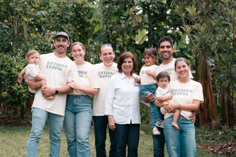 Smiling family in front of a forest