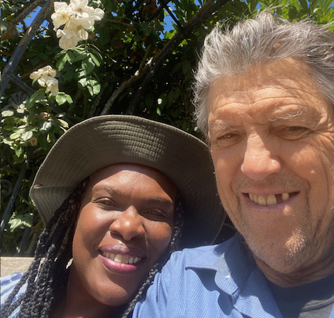 Smiling man and woman outside