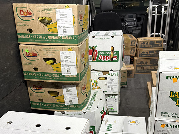 Boxes of fresh fruit in the back of a vehicle