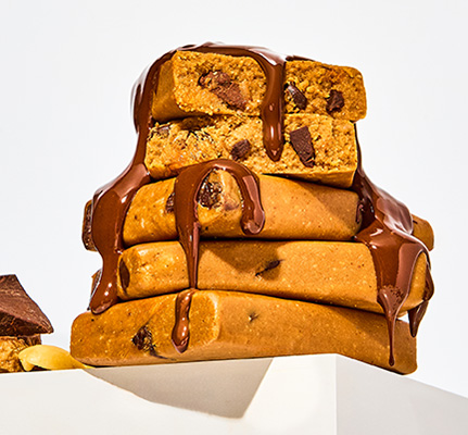 Stack of chocolate chip KiZE Bars with melted chocolate on top