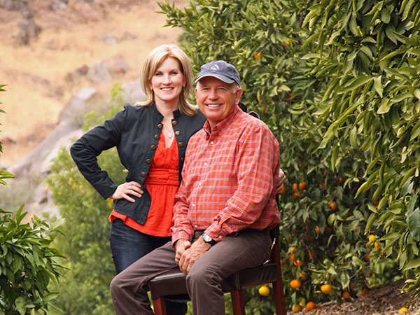 Smiling couple in an orchard