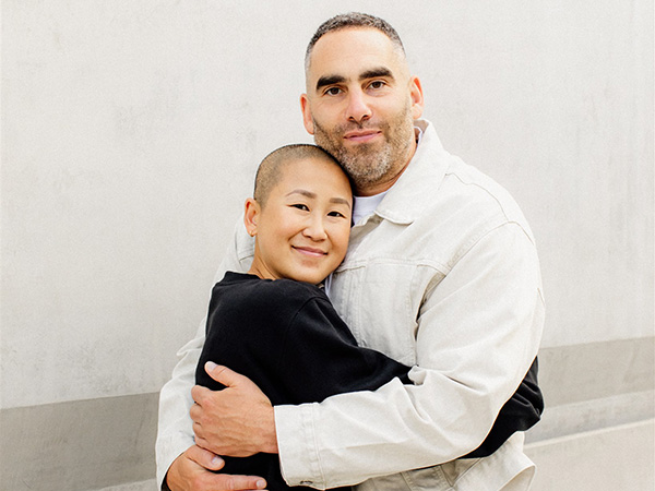 Smiling man and woman hugging