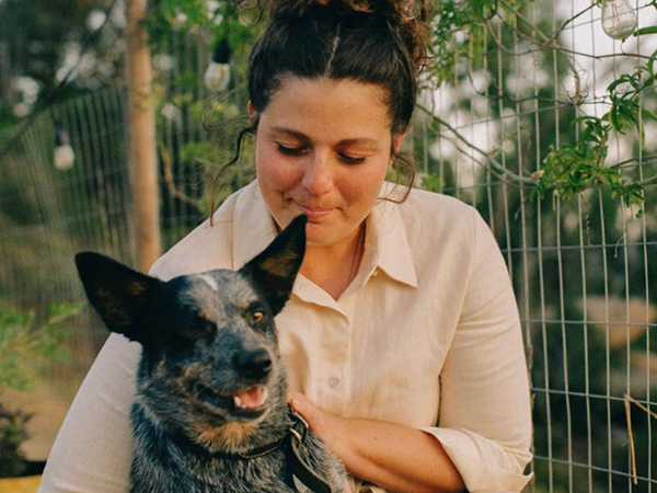 Woman holding cattle dog