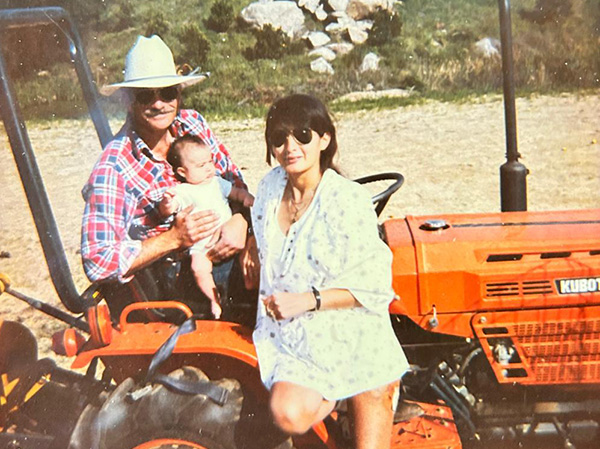 Smiling family on a tractor