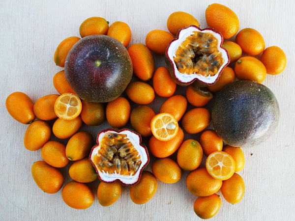 Kumquats and passion fruits, whole and sliced